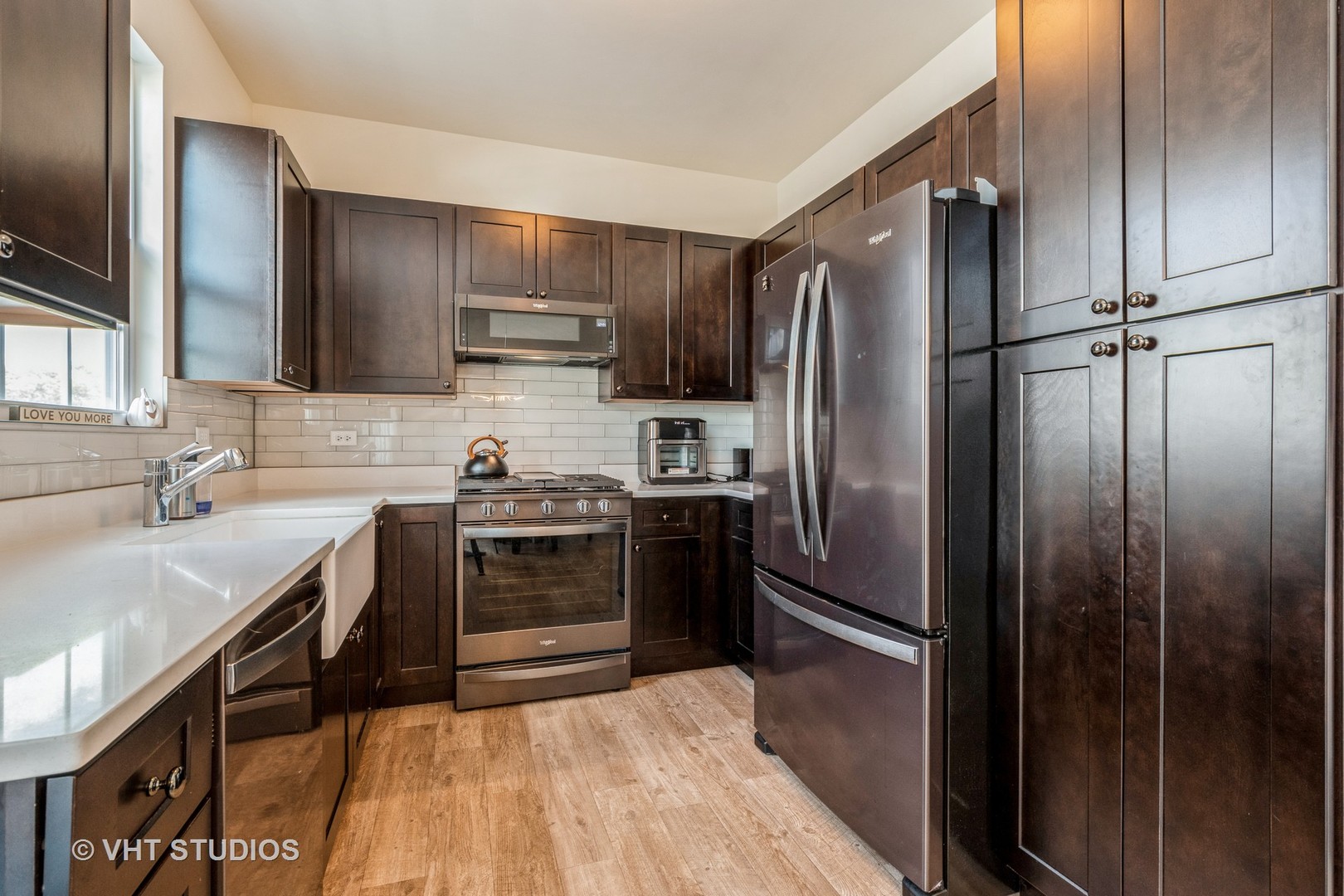 285 Timber Ridge Court Joliet, IL 60431 - Photo 6 of 21 a kitchen with stainless steel appliances granite countertop a refrigerator stove and sink