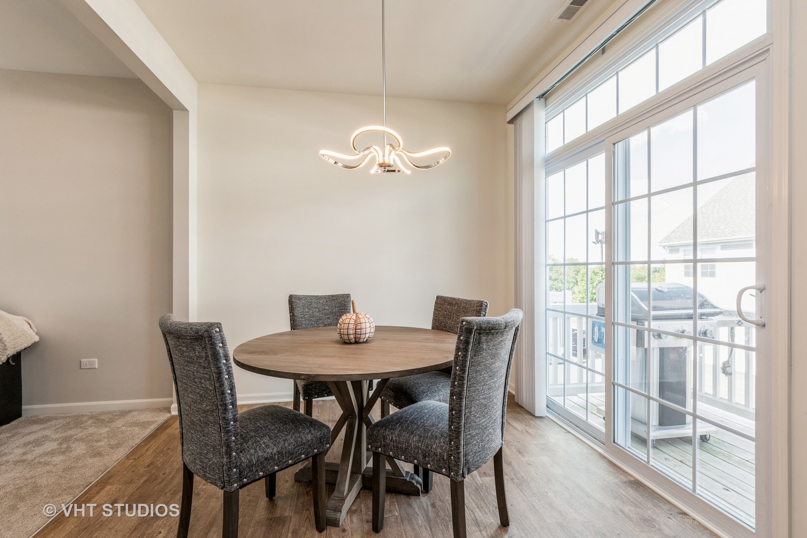 285 Timber Ridge Court Joliet, IL 60431 - Photo 8 of 21 a view of a dining room with furniture wooden floor and a chandelier