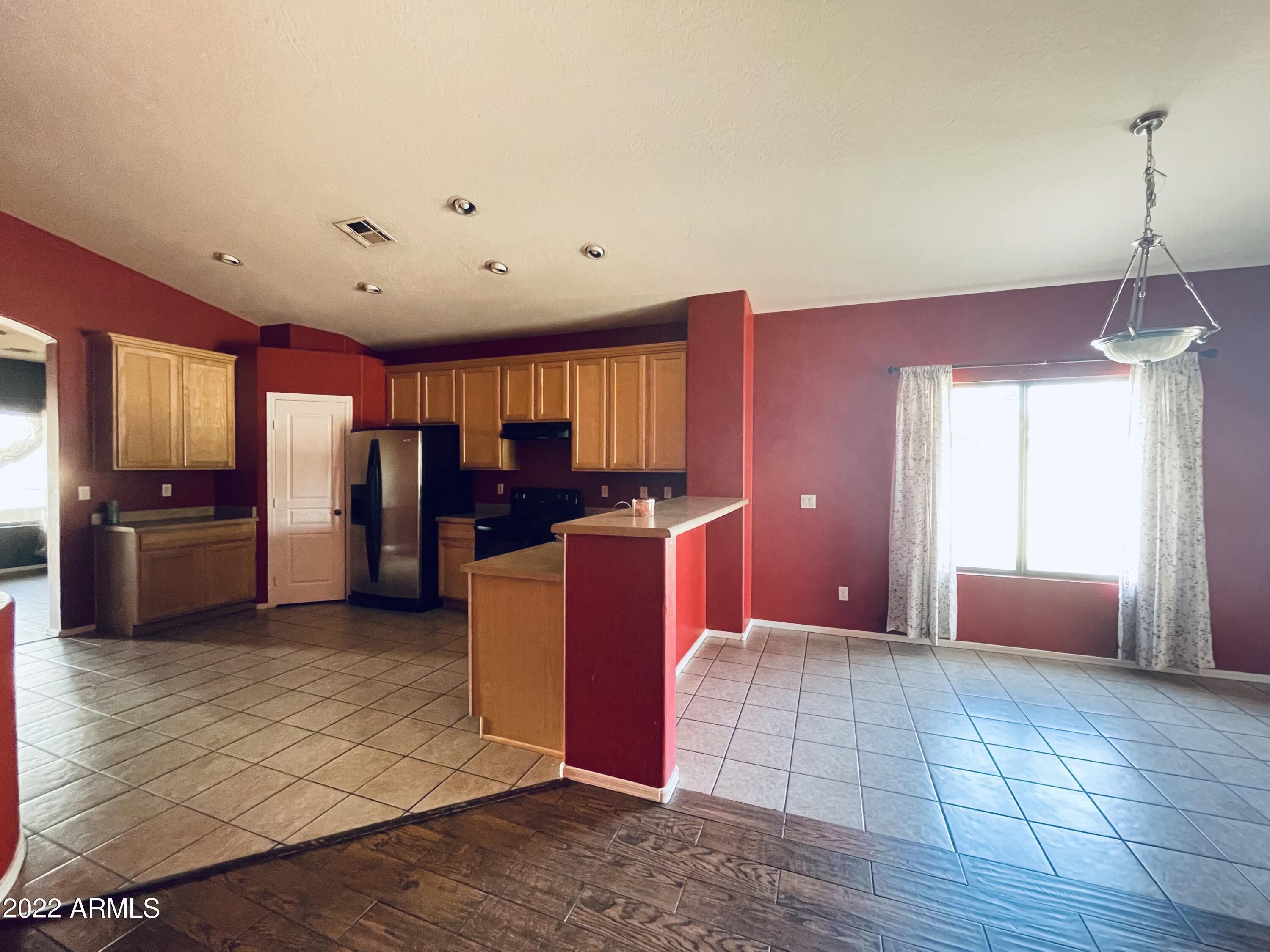 1215 West Carson Road Phoenix, AZ 85041 - Photo 7 of 42 view to kitchen and Family rm
