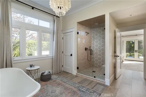 a view of an outdoor dining space with furniture and garden view