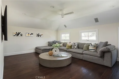 a bathroom with a double vanity sink a mirror a bathtub and shower