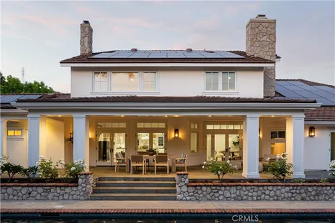 a view of yard with swimming pool and green space