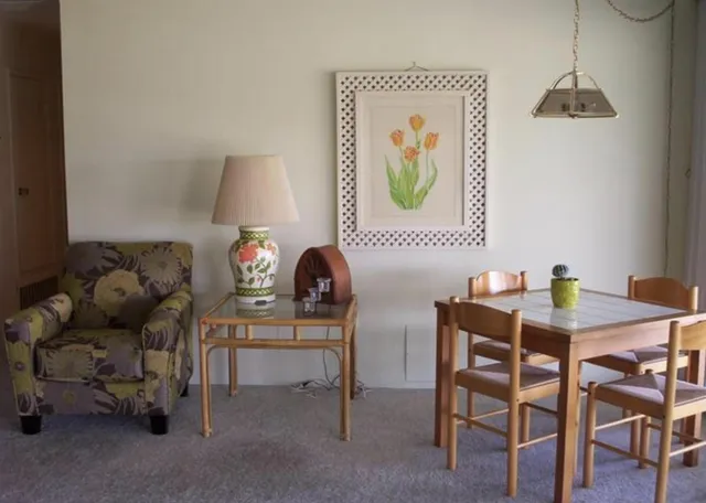 a view of a workspace with furniture