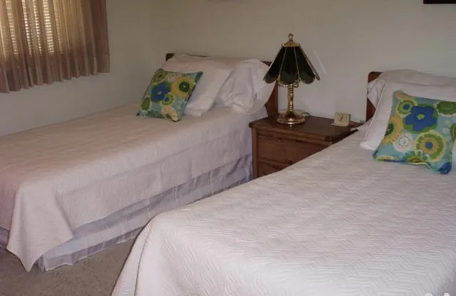 a bedroom with bed and window