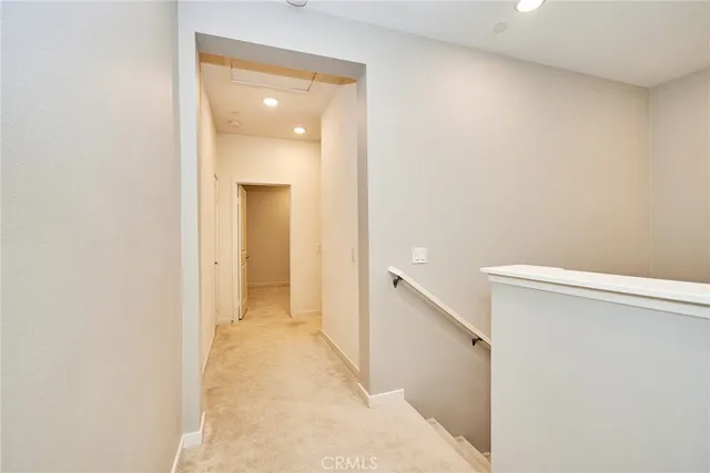 a view of a hallway with a white walls
