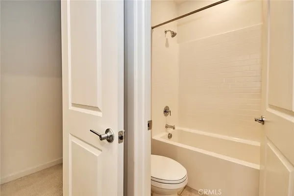 a bathroom with a shower a bathtub and a shower