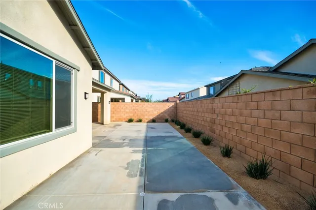 a view of a pathway of a building with an outdoor space