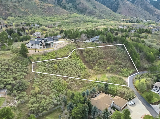 10667 Hidden Ridge Lane Sandy, UT 84092 - Photo 13 of 21 Aerial overview of property's location with property parcel outlined and a mountain backdrop