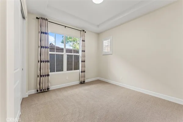 a view of an empty room with glass door