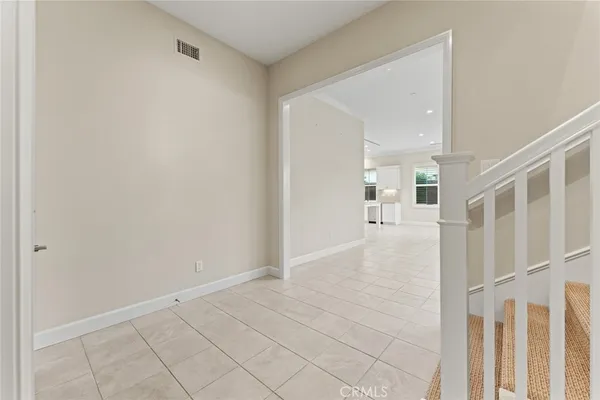 a view of a hallway view with wooden floor and staircase