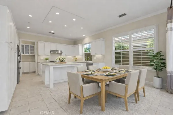 a dining room with furniture and window