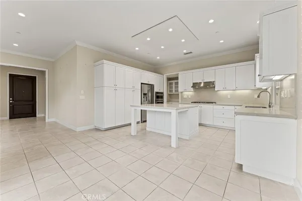 a kitchen with counter top space cabinets and appliances