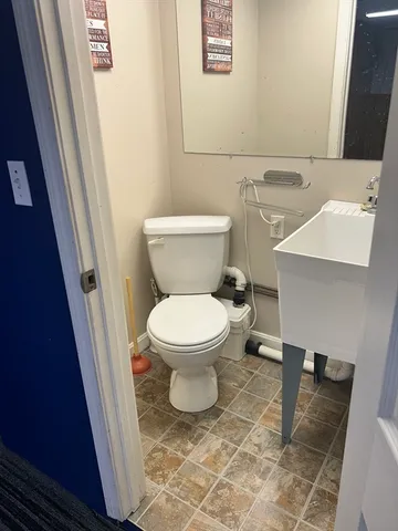 a bathroom with a toilet and a sink