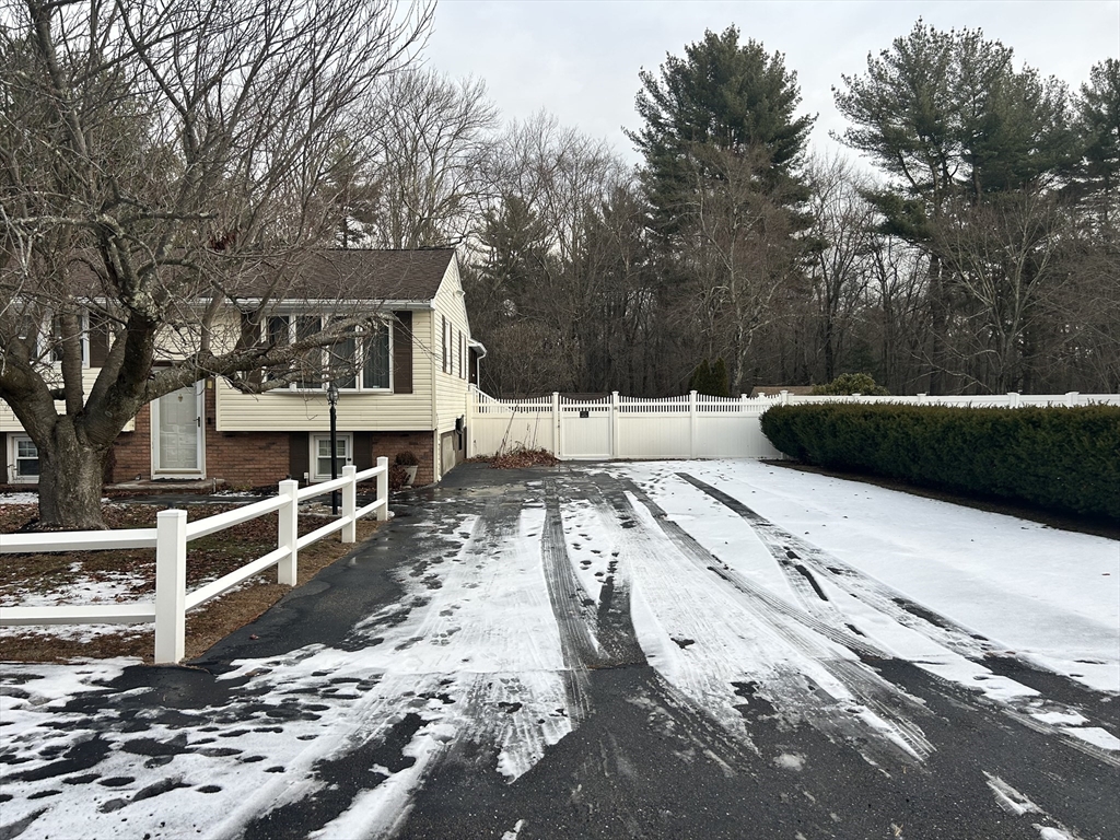 31 Harjean Road Billerica, MA 01821 - Photo 3 of 15 a view of a house with a yard covered in snow
