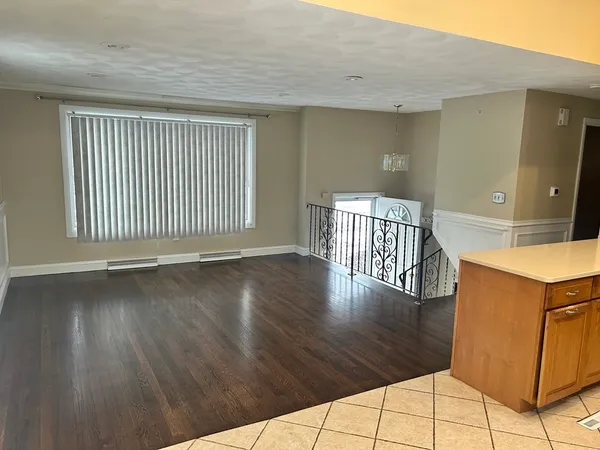 a view of a livingroom with wooden floor