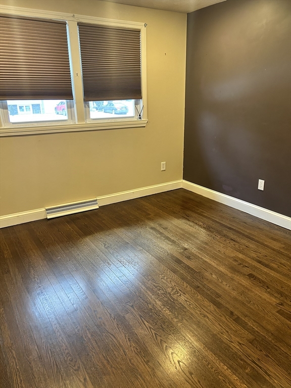 31 Harjean Road Billerica, MA 01821 - Photo 8 of 15 a view of an empty room with wooden floor and a window