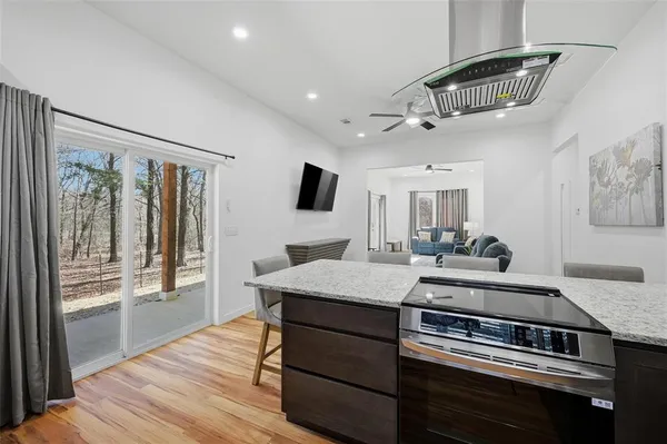 a kitchen with stainless steel appliances granite countertop a refrigerator and a sink