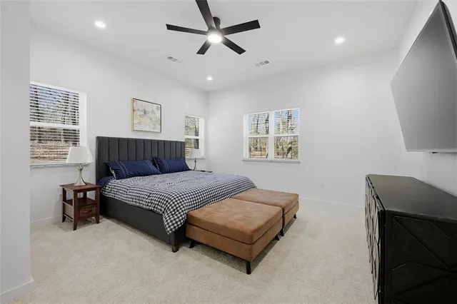 a kitchen with a stove and a wooden floor