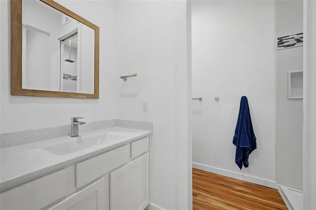 a bathroom with a shower and a window