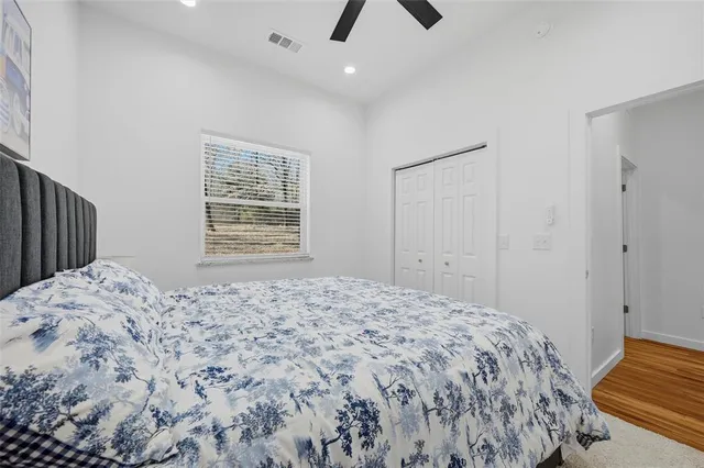 a bedroom with a bed and a chair