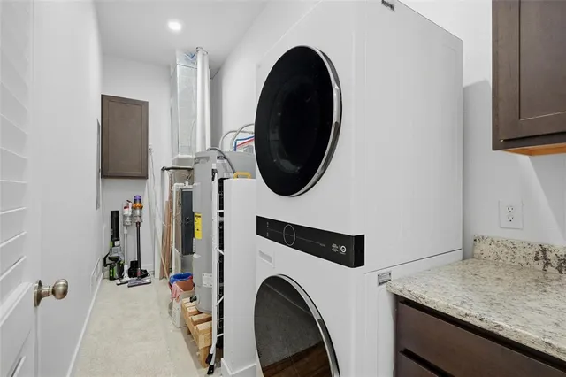 a bathroom with a sink a toilet and shower curtain