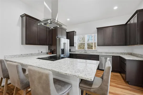 a living room with furniture and a rug