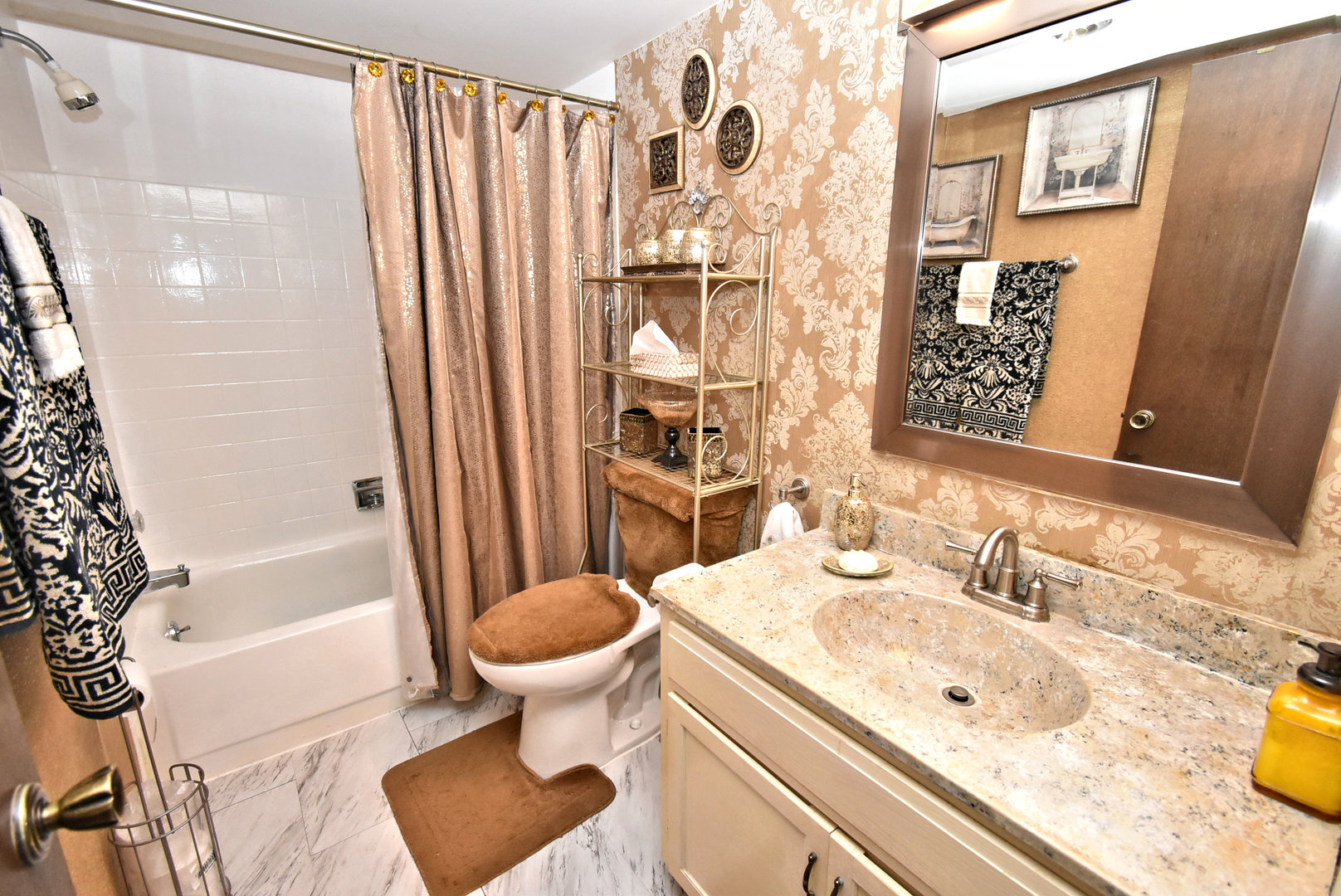 18855 Burnham Avenue, Unit 234 Lansing, IL 60438 - Photo 18 of 25 a bathroom with a sink toilet and shower