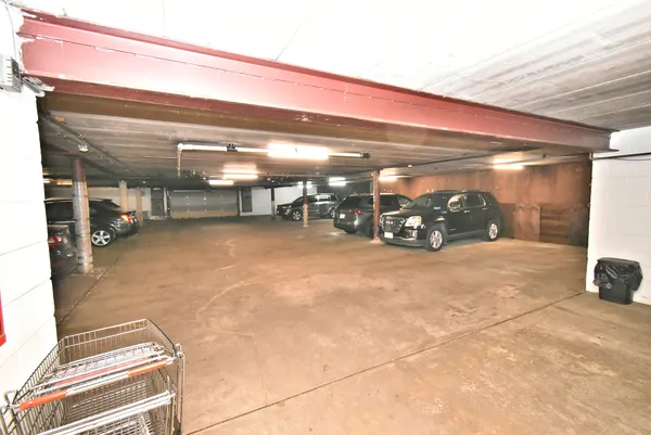 a view of a garage with cars