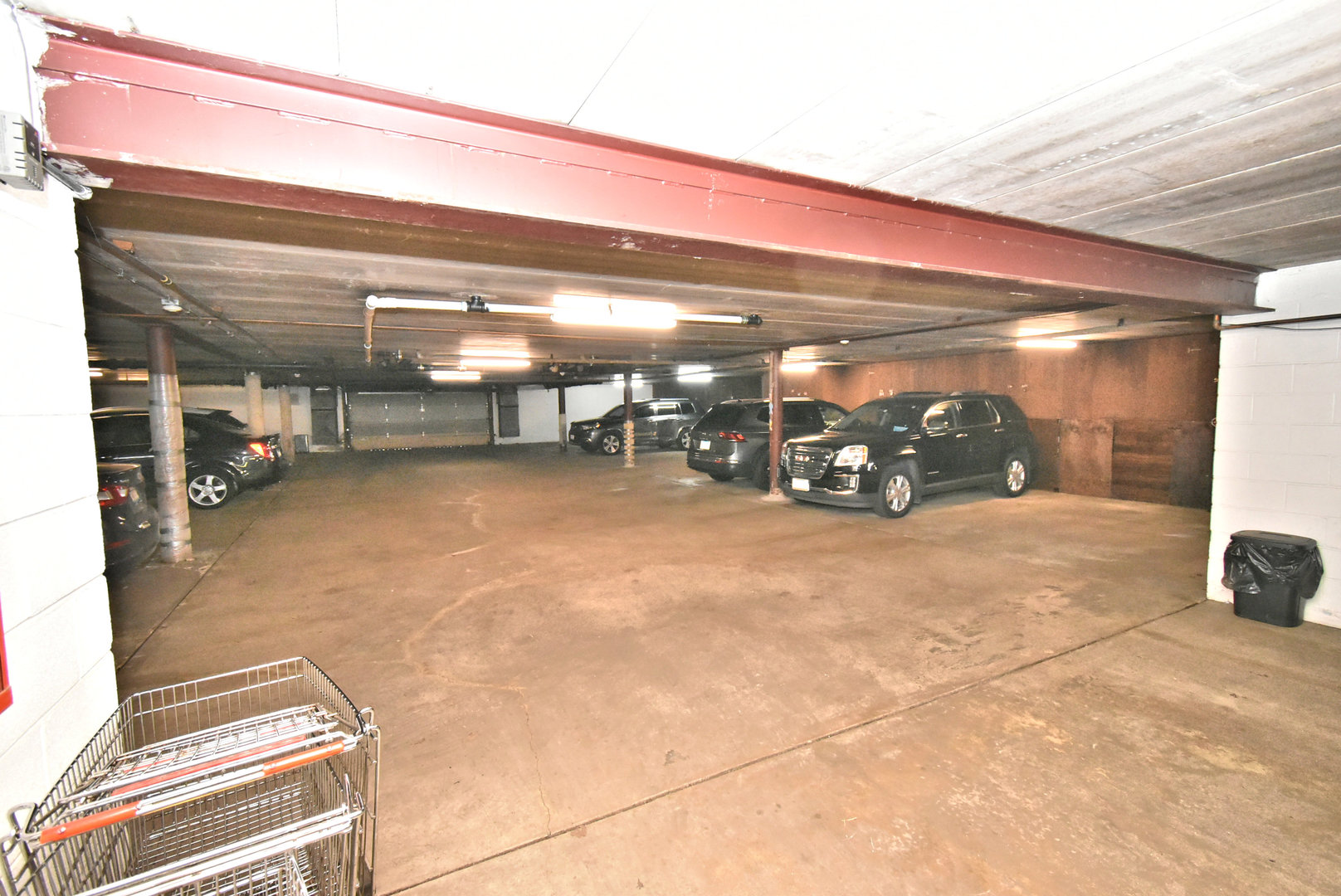 18855 Burnham Avenue, Unit 234 Lansing, IL 60438 - Photo 22 of 25 a view of a garage with cars