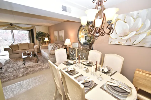 a view of a dining room with furniture window and outside view