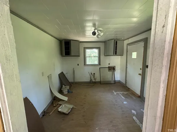 a view of a livingroom with furniture and windows