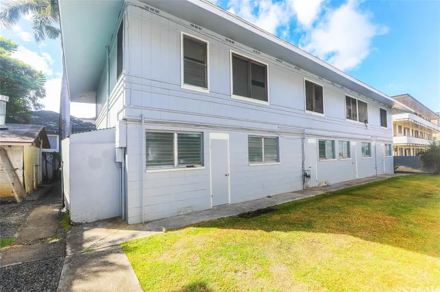 a view of a house with pool and a yard