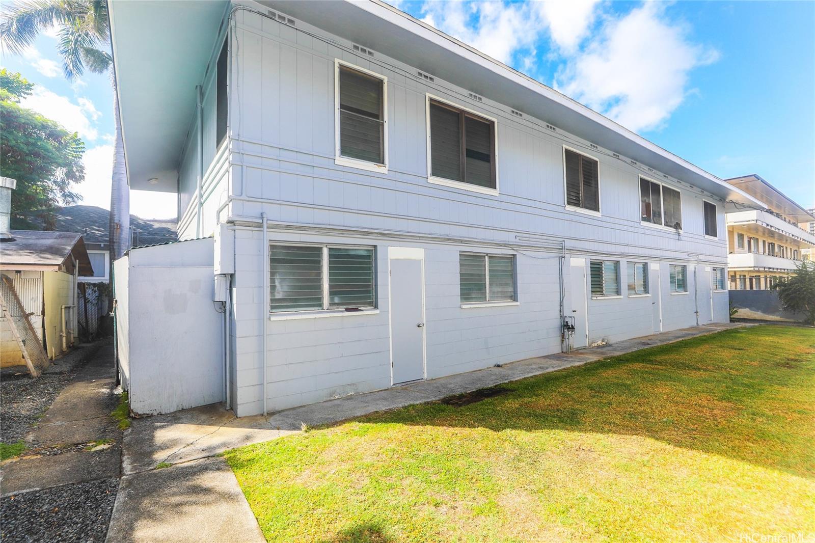 a view of a house with pool and a yard