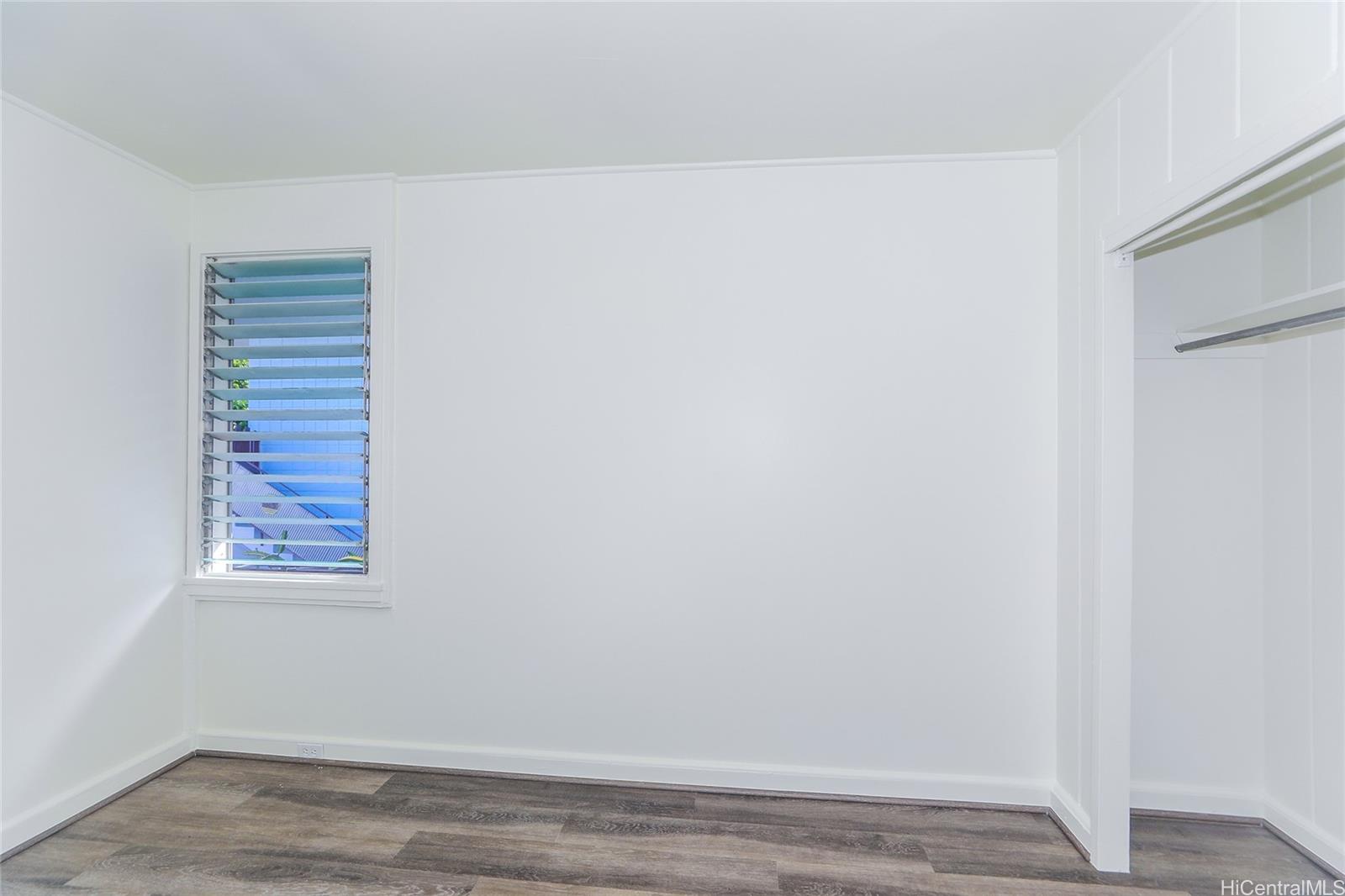 1719 Nuuanu Avenue, Unit 5E Honolulu, HI 96817 - Photo 12 of 25 a view of a small space with wooden floor and a window