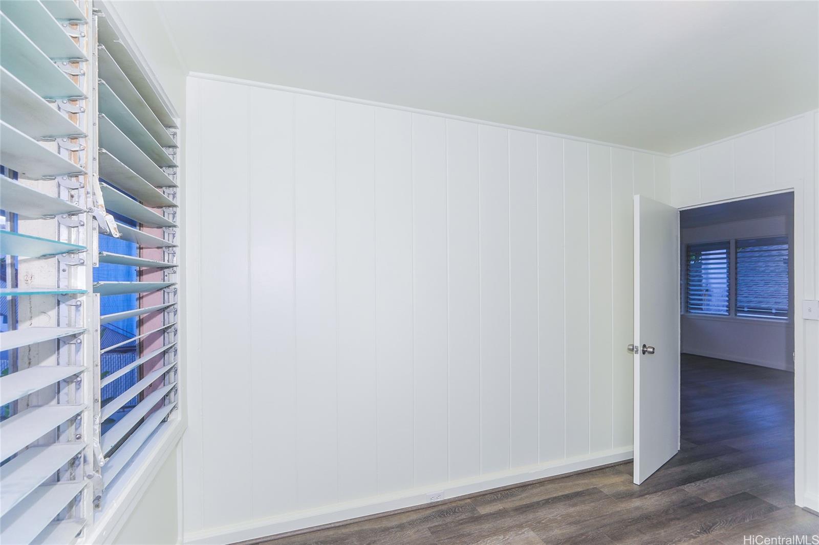 1719 Nuuanu Avenue, Unit 5E Honolulu, HI 96817 - Photo 20 of 25 a view of a room with wooden floor and a view of bathroom