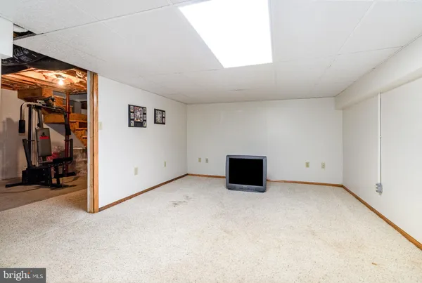 a view of an empty room with a fireplace