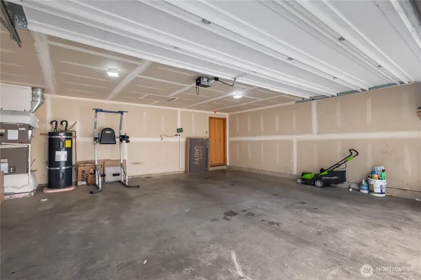 a view of a room with air conditioner duct and materials on floor