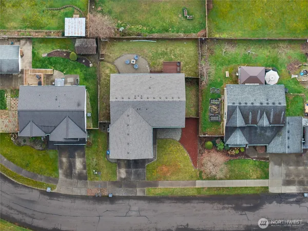 an aerial view of a house with outdoor space