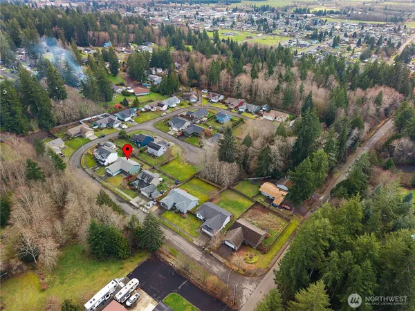 an aerial view of a house with a lake view