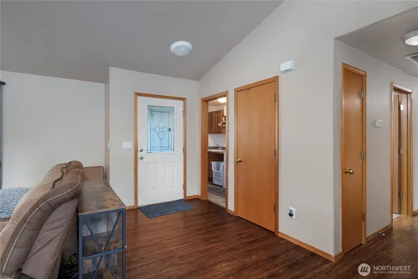 a view of a livingroom with wooden floor and closet
