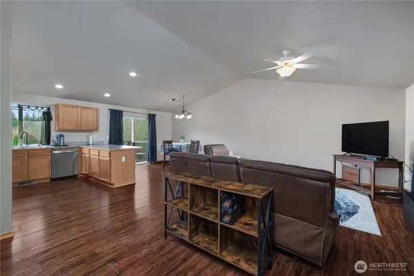 a view of a livingroom with furniture and a flat screen tv