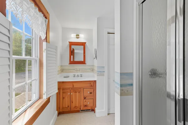 a bathroom with a sink and a mirror