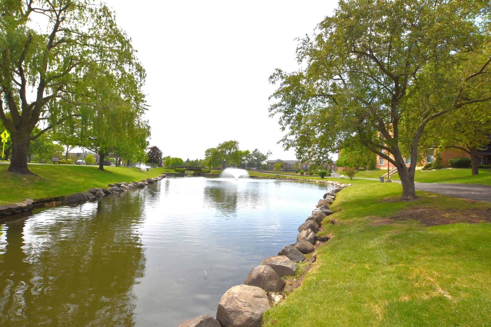 500 West Huntington Commons Road, Unit 157 Mount Prospect, IL 60056 - Photo 5 of 24 a swimming pool view with a lake view