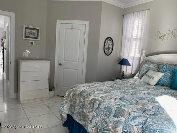 a bedroom with a bed and a closet