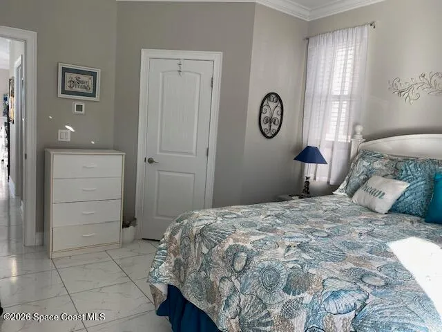 a bedroom with a bed and a closet