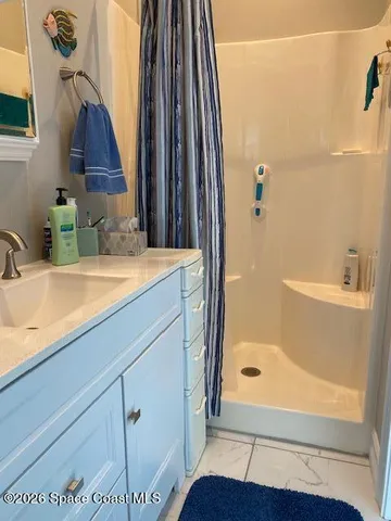 a bathroom with a tub and a sink
