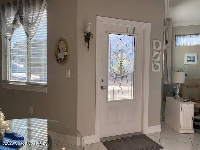 a bathroom with a window and a mirror