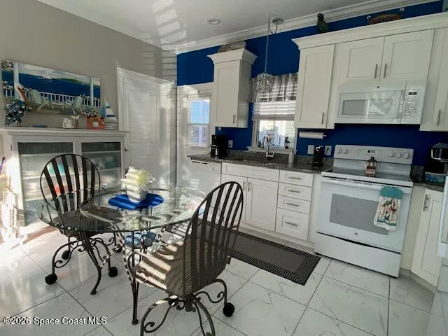 a kitchen with a table chairs and a stove