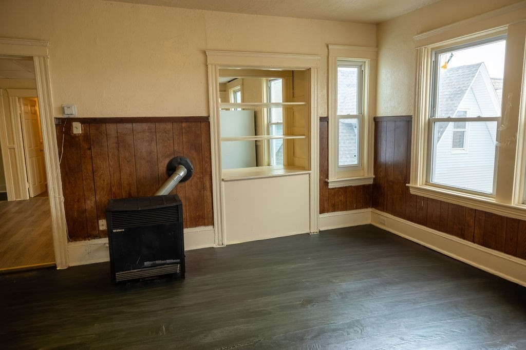42 Dorcester, Unit 3 Worcester, MA 01604 - Photo 28 of 29 a view of an empty room with wooden floor and a window