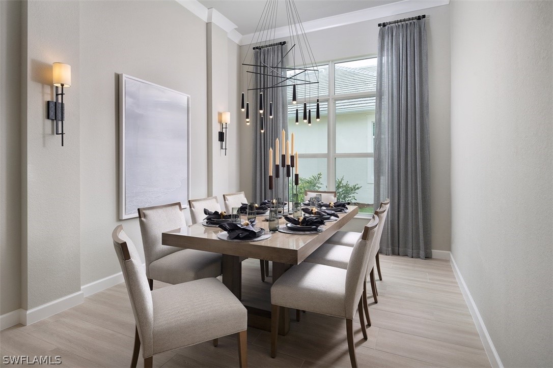 6181 Megans Bay Drive Naples, FL 34113 - Photo 12 of 32 a view of a dining room with furniture and window